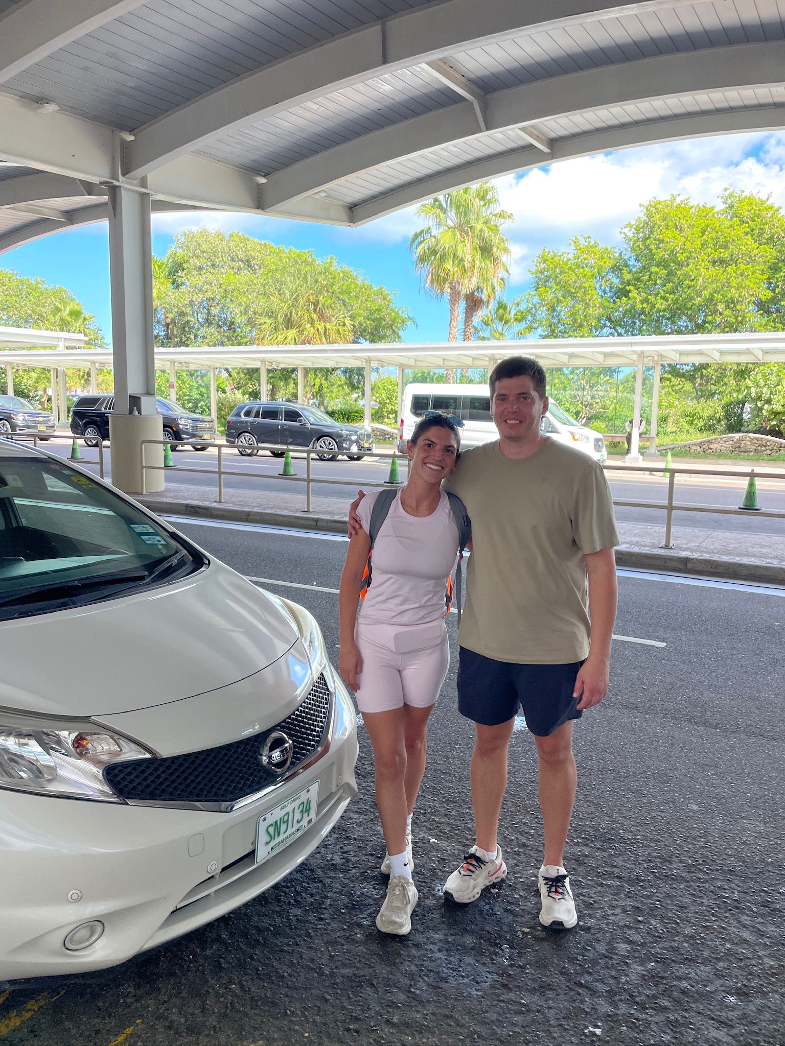 D'Luxe Rentals customer with sedan rental in Nassau Bahamas
